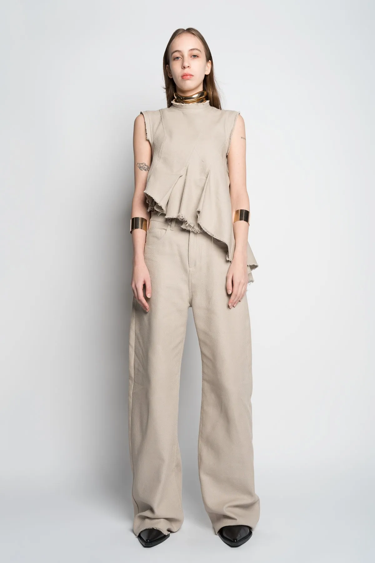 BEIGE WOVEN SLEEVELESS TOP WITH ASYMMETRIC HEM