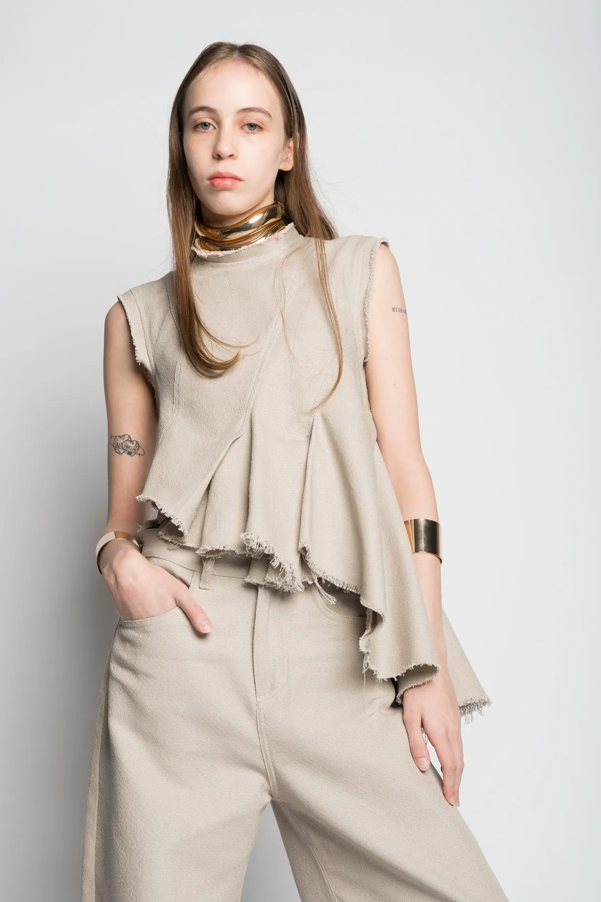 BEIGE WOVEN SLEEVELESS TOP WITH ASYMMETRIC HEM